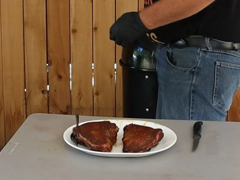 Perfectly smoked turkey thighs on a serving platter