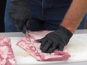 Trimming the rack of spare ribs into a St. Louis cut