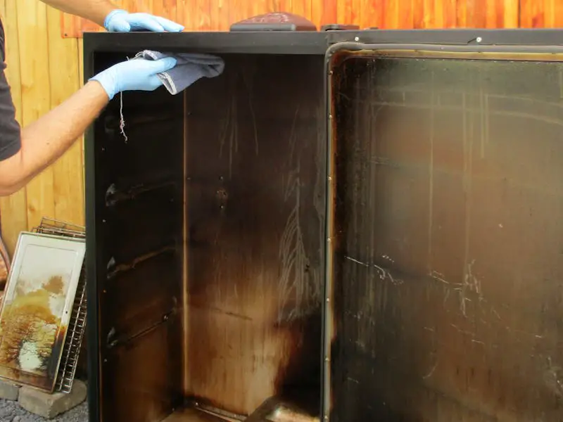 wiping the inside top of the masterbuilt electric smoker